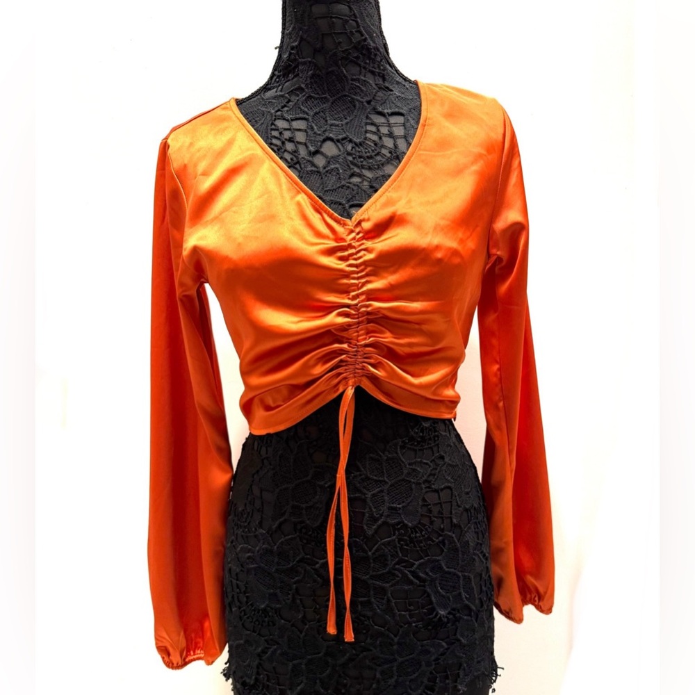 Satiny bright orange long sleeve crop blouse